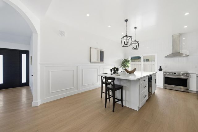 a kitchen with a sink cabinets and window