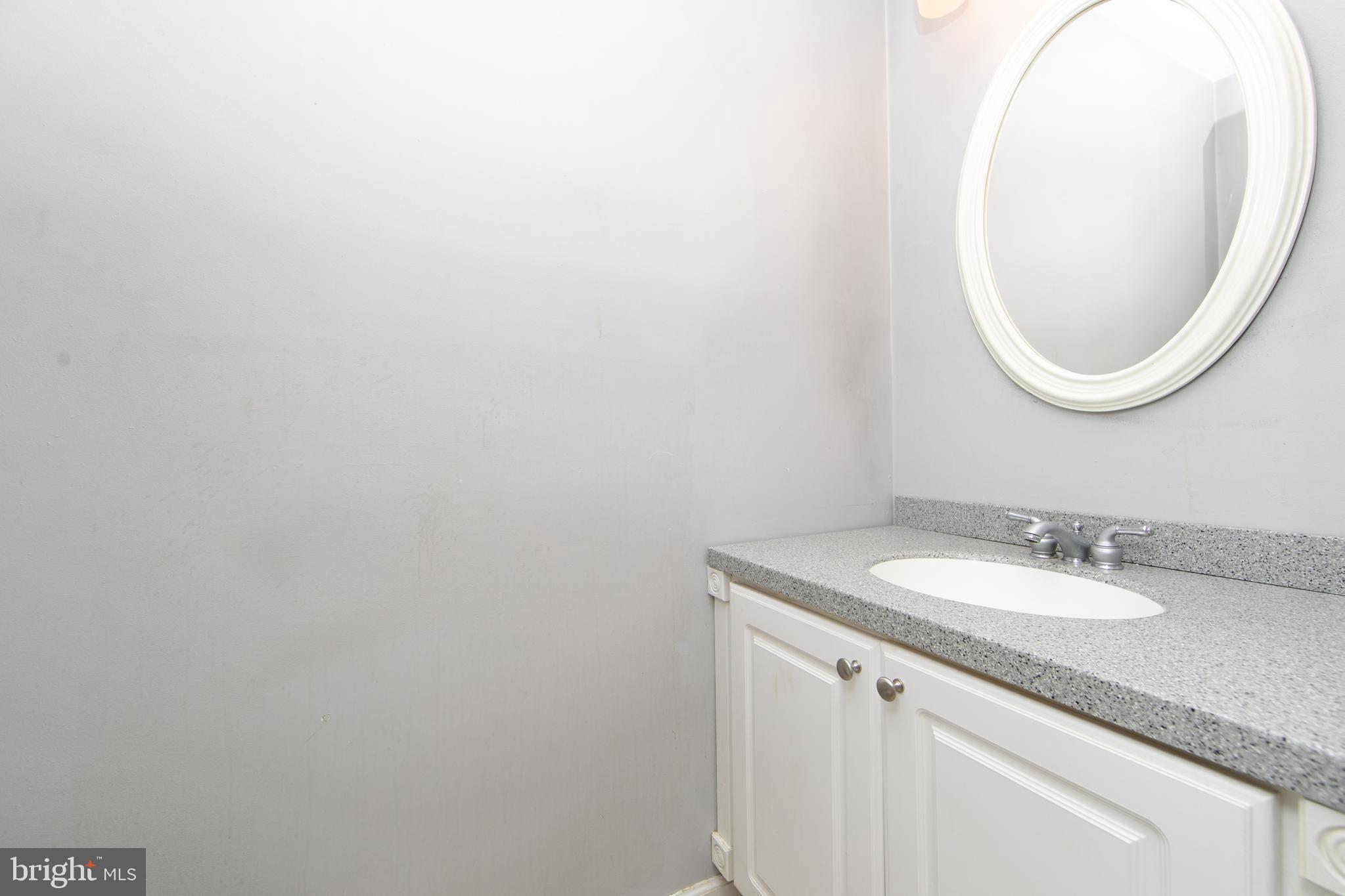 606 Kings Croft Drive Cherry Hill, NJ 08034 - Photo 25 of 35 a bathroom with a sink and a mirror