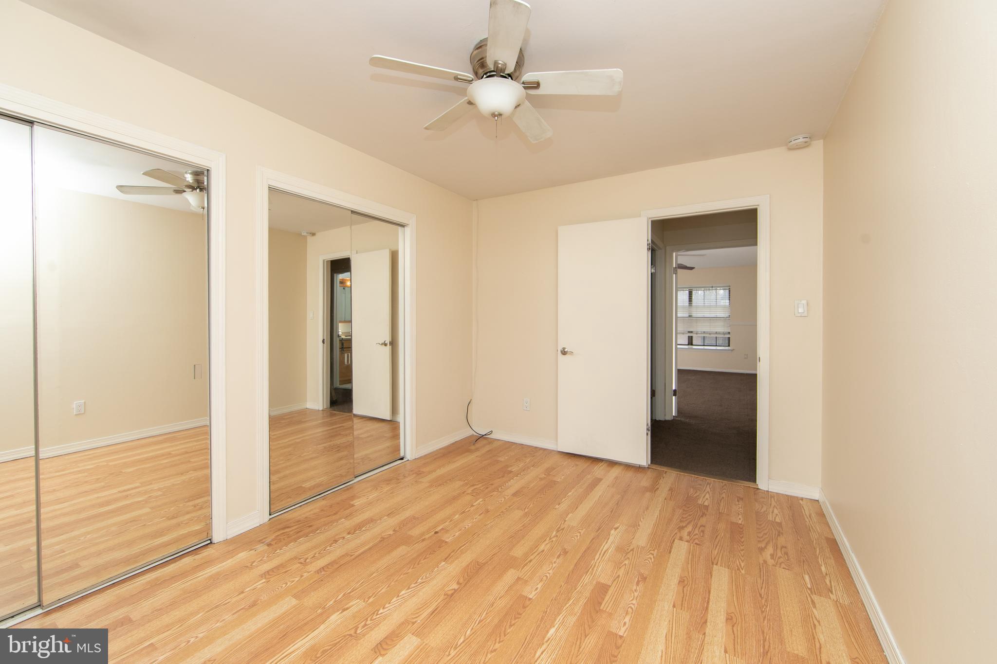 606 Kings Croft Drive Cherry Hill, NJ 08034 - Photo 27 of 35 a view of a room with a closet and a ceiling fan