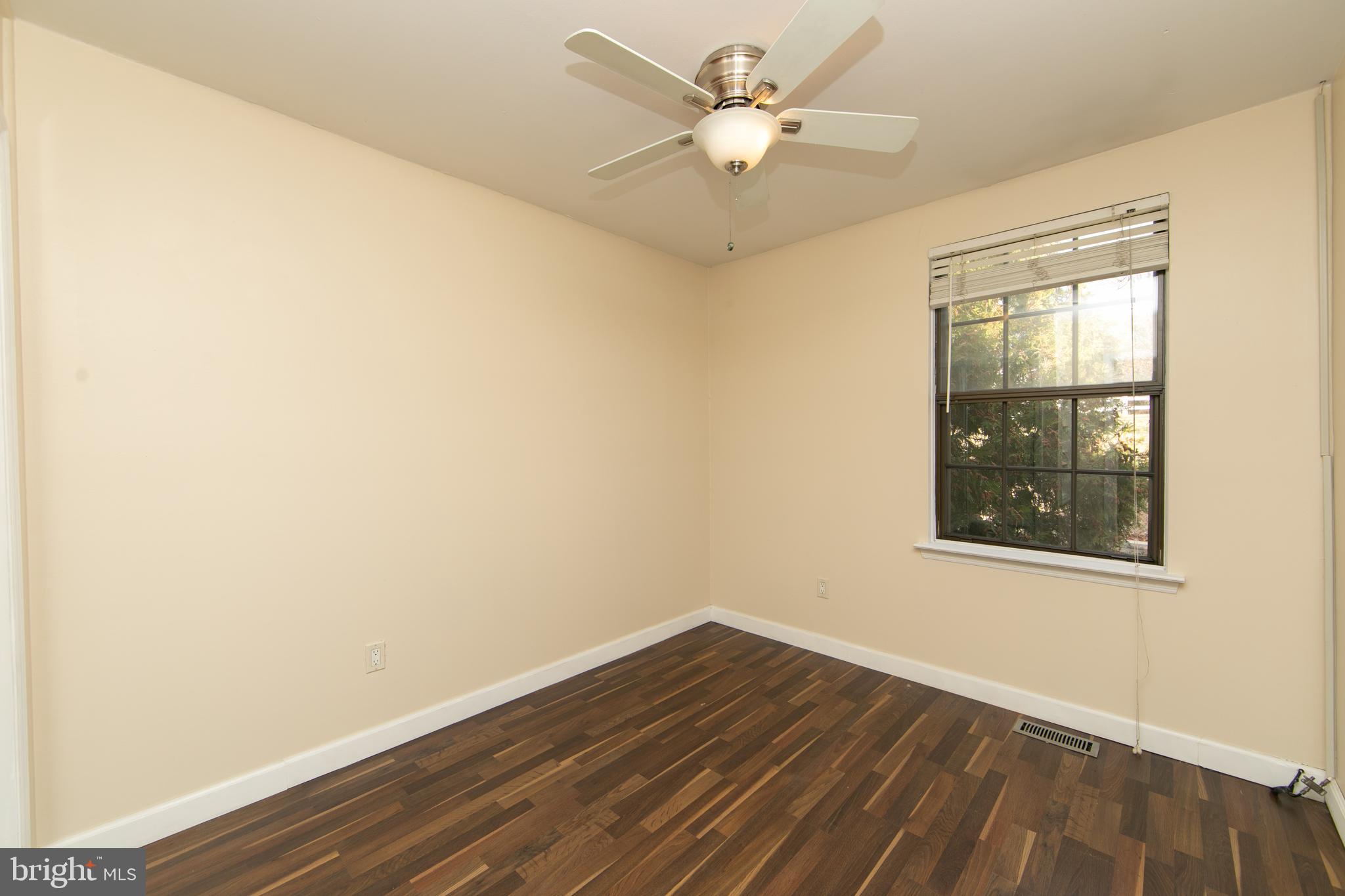 606 Kings Croft Drive Cherry Hill, NJ 08034 - Photo 29 of 35 an empty room with wooden floor and windows