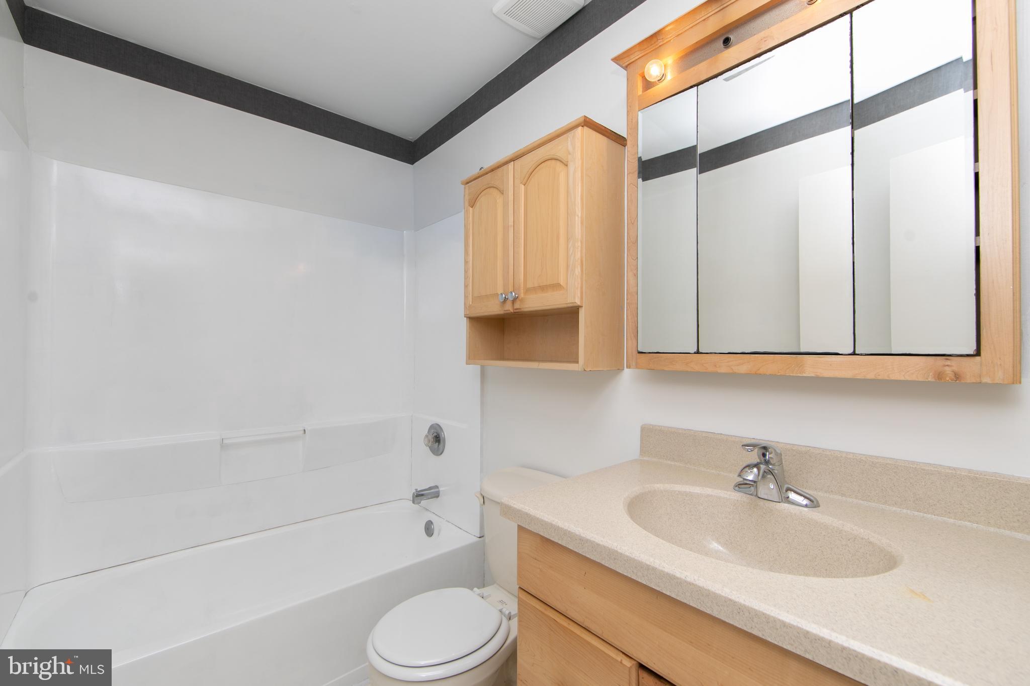 606 Kings Croft Drive Cherry Hill, NJ 08034 - Photo 33 of 35 a bathroom with a sink a toilet and bathtub