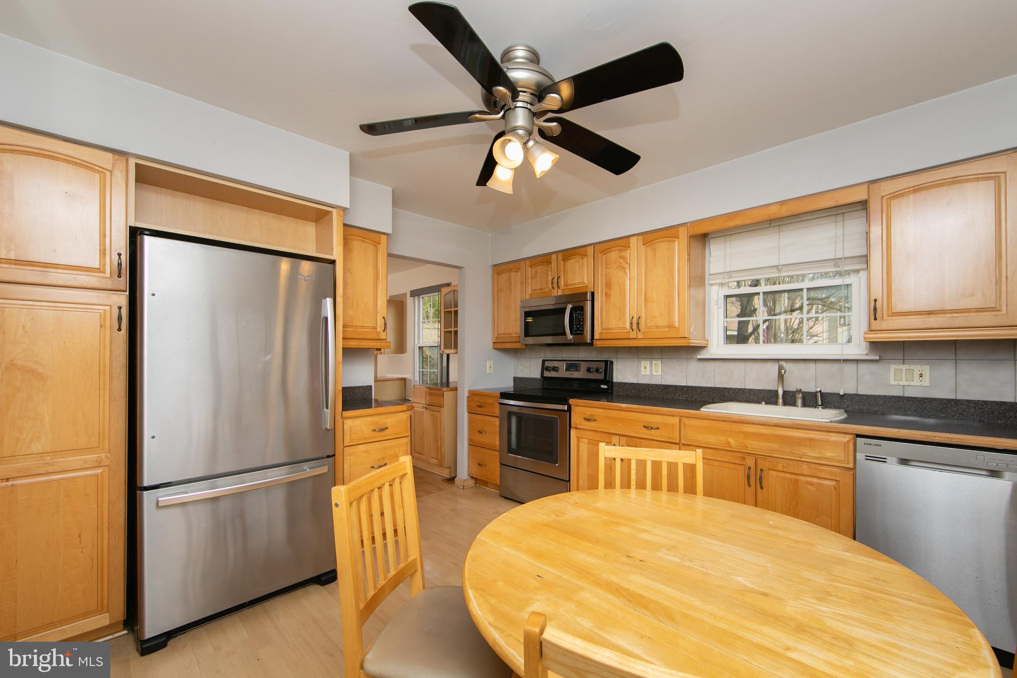 606 Kings Croft Drive Cherry Hill, NJ 08034 - Photo 4 of 35 a kitchen with stainless steel appliances a refrigerator and a stove top oven