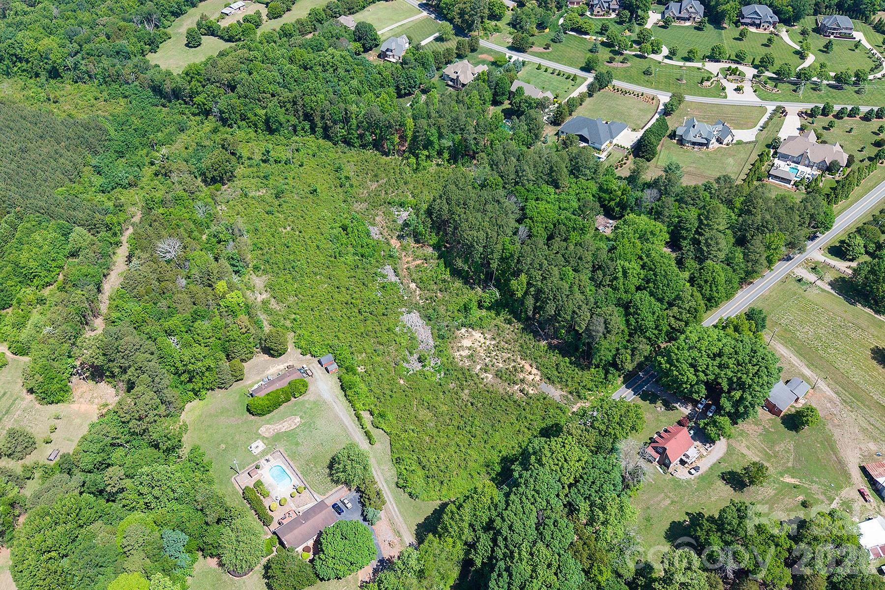 13745 Ramah Church Road Huntersville, NC 28078 - Photo 3 of 17 an aerial view of residential house with outdoor space and trees all around