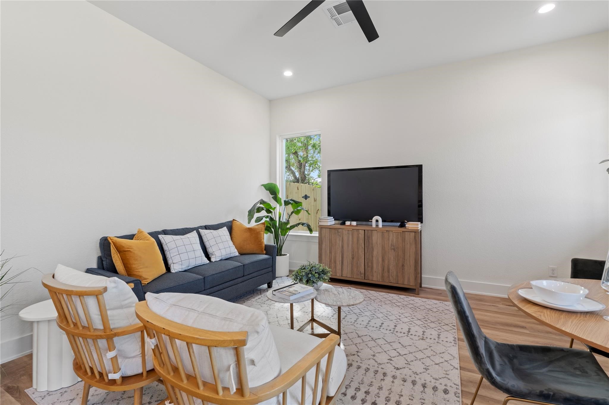 6532 Weston Street, Unit A Houston, TX 77021 - Photo 12 of 29 a living room with furniture and a flat screen tv