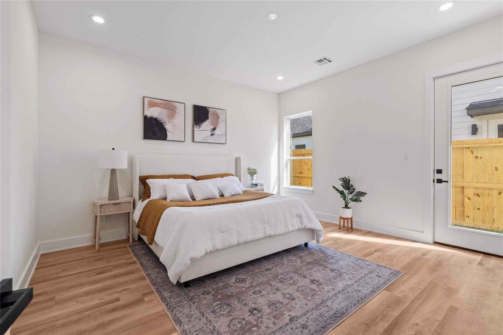 6532 Weston Street, Unit A Houston, TX 77021 - Photo 14 of 29 a spacious bedroom with a bed and a rug