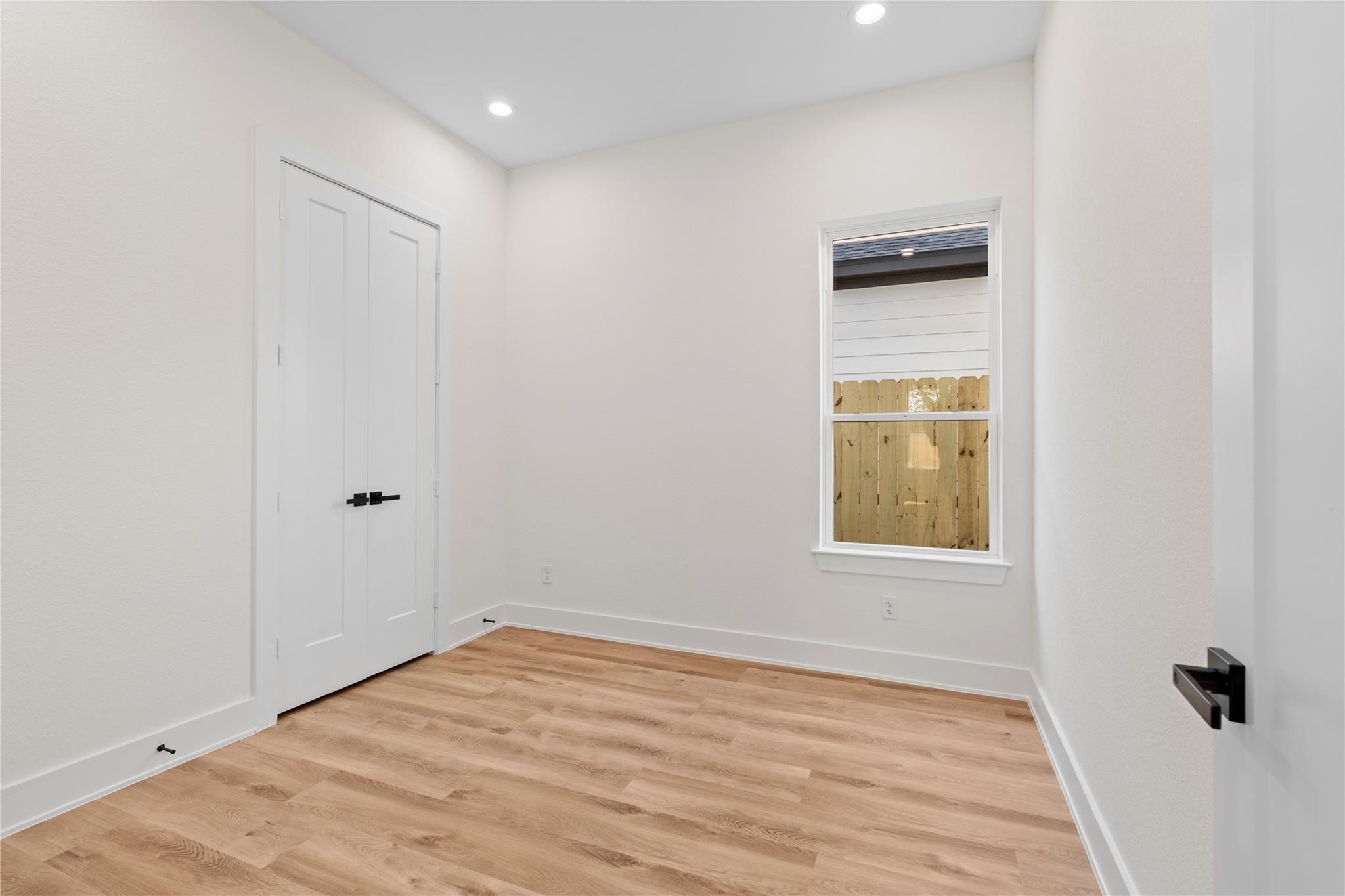 6532 Weston Street, Unit A Houston, TX 77021 - Photo 25 of 29 a view of empty room with wooden floor and window