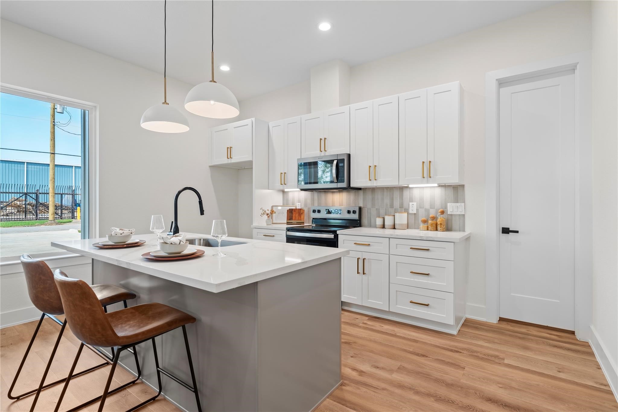 6532 Weston Street, Unit A Houston, TX 77021 - Photo 6 of 29 a kitchen with a sink cabinets and window