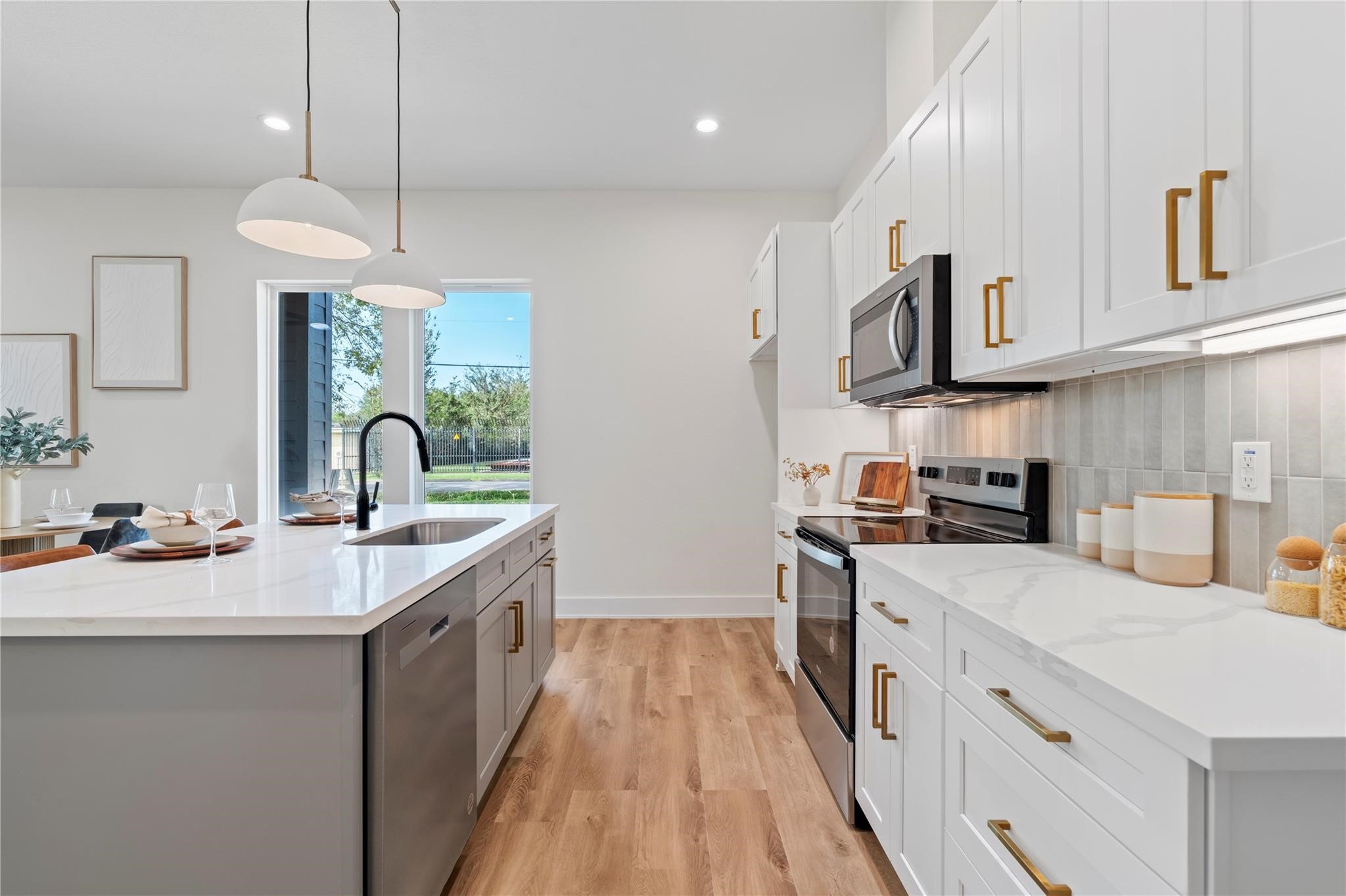6532 Weston Street, Unit A Houston, TX 77021 - Photo 7 of 29 a kitchen with stainless steel appliances granite countertop a sink stove and refrigerator
