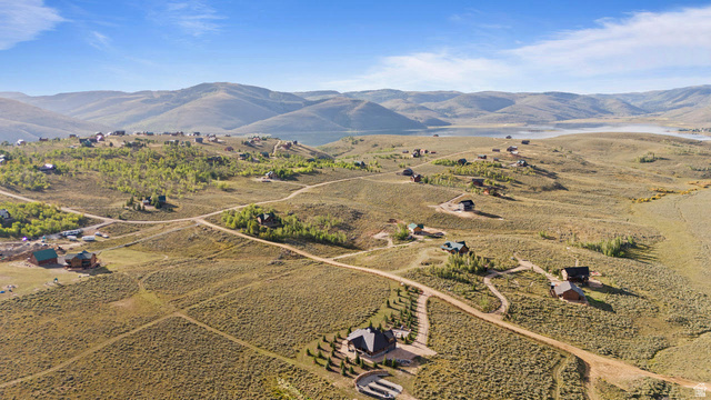 61 Skyline, Unit 61 Helper, UT 84526 - Photo 10 of 31 Expansive, undeveloped land featuring multiple residential structures and unpaved roadways