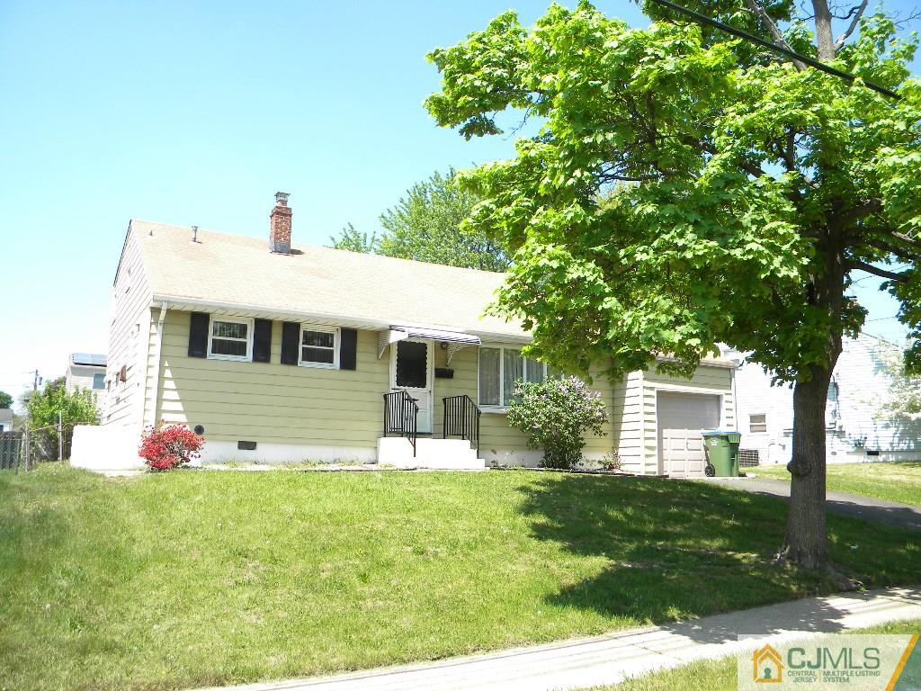 69 Eardley Road Edison, NJ 08817 - Photo 2 of 13 a front view of house with yard and trees