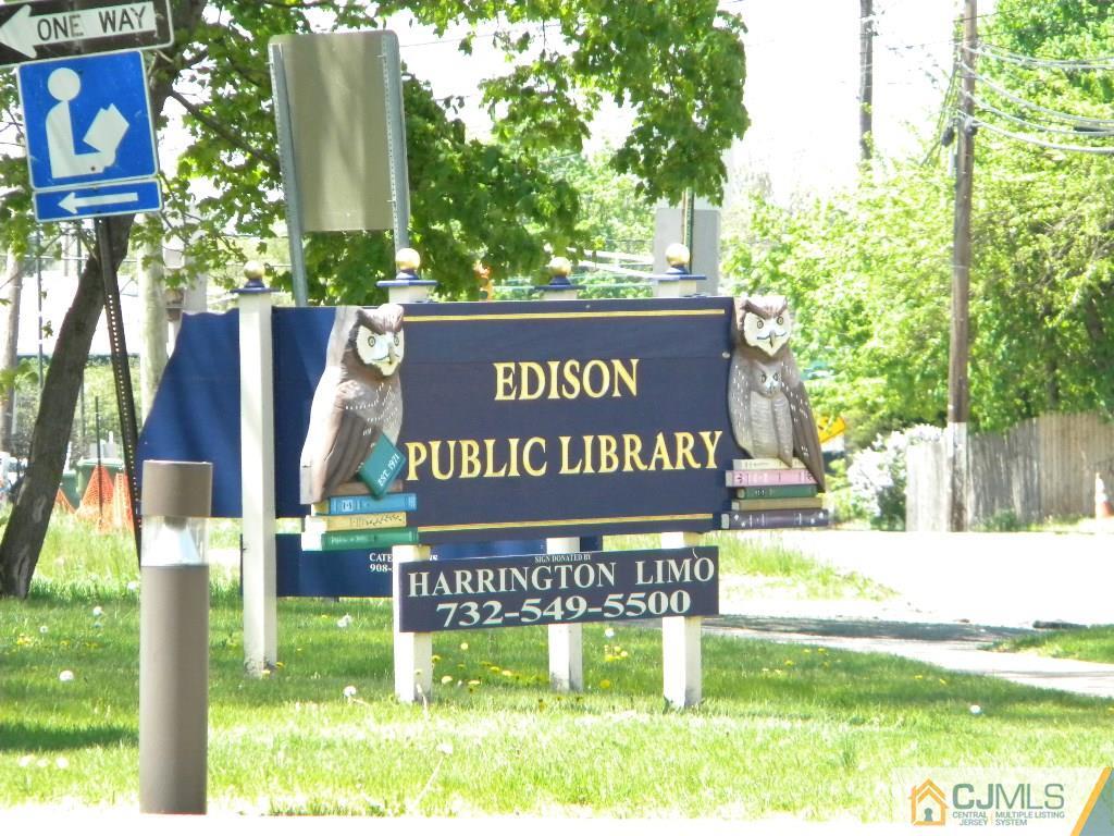 69 Eardley Road Edison, NJ 08817 - Photo 11 of 13 a view of outdoor space with a garden and signage