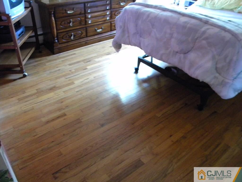 69 Eardley Road Edison, NJ 08817 - Photo 9 of 13 a view of a room with wooden floor