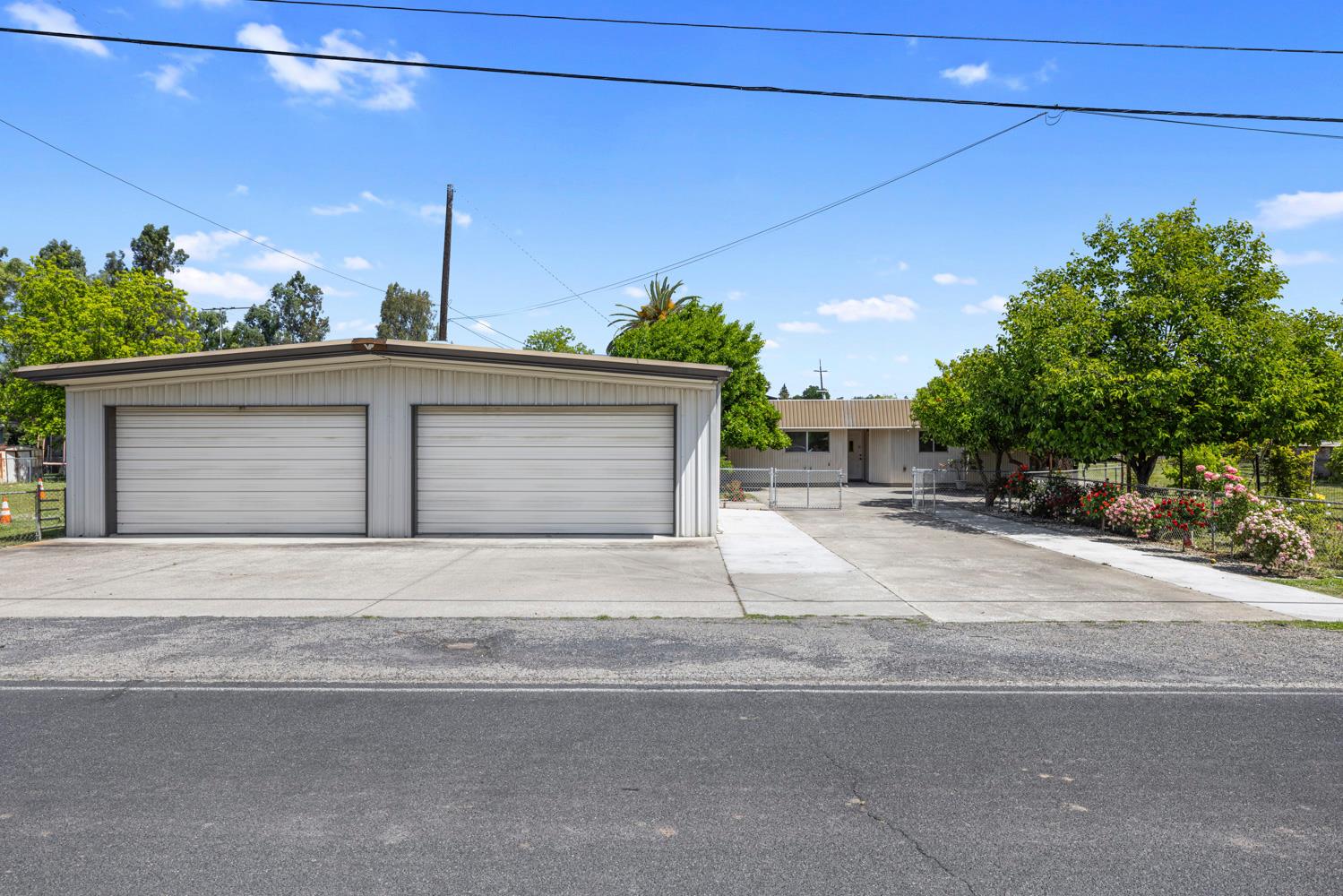 a front view of a house with a yard and a garage