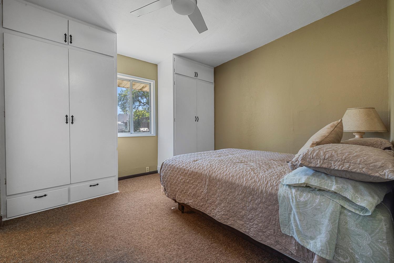 3824 Hubbard Road Stockton, CA 95215 - Photo 15 of 79 a bedroom with a bed and a window