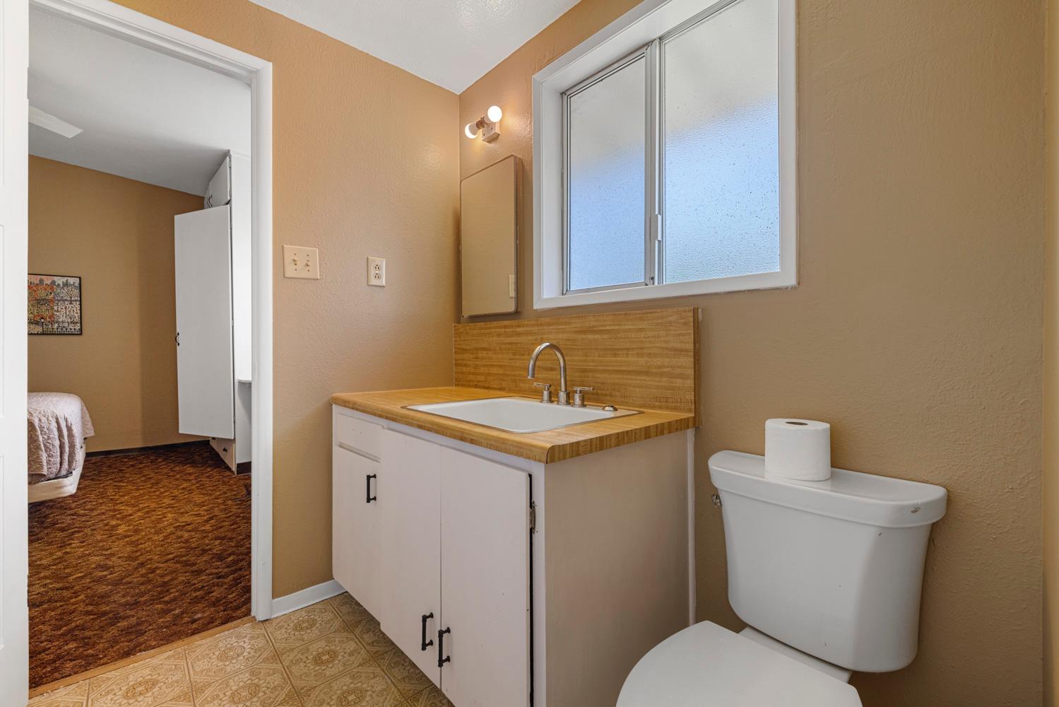 3824 Hubbard Road Stockton, CA 95215 - Photo 17 of 79 a bathroom with a sink toilet and shower