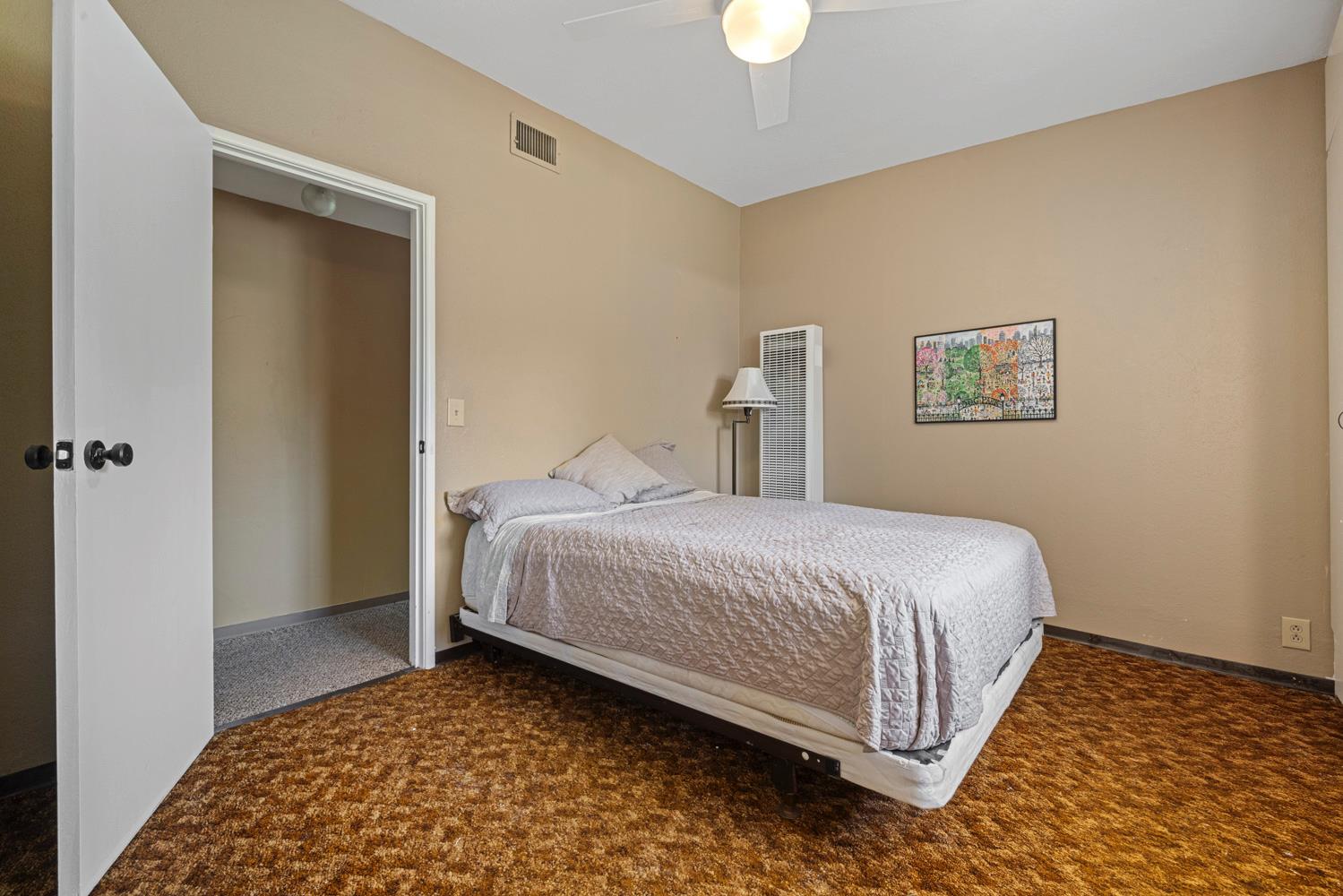 3824 Hubbard Road Stockton, CA 95215 - Photo 18 of 79 a bedroom with a bed and a rug