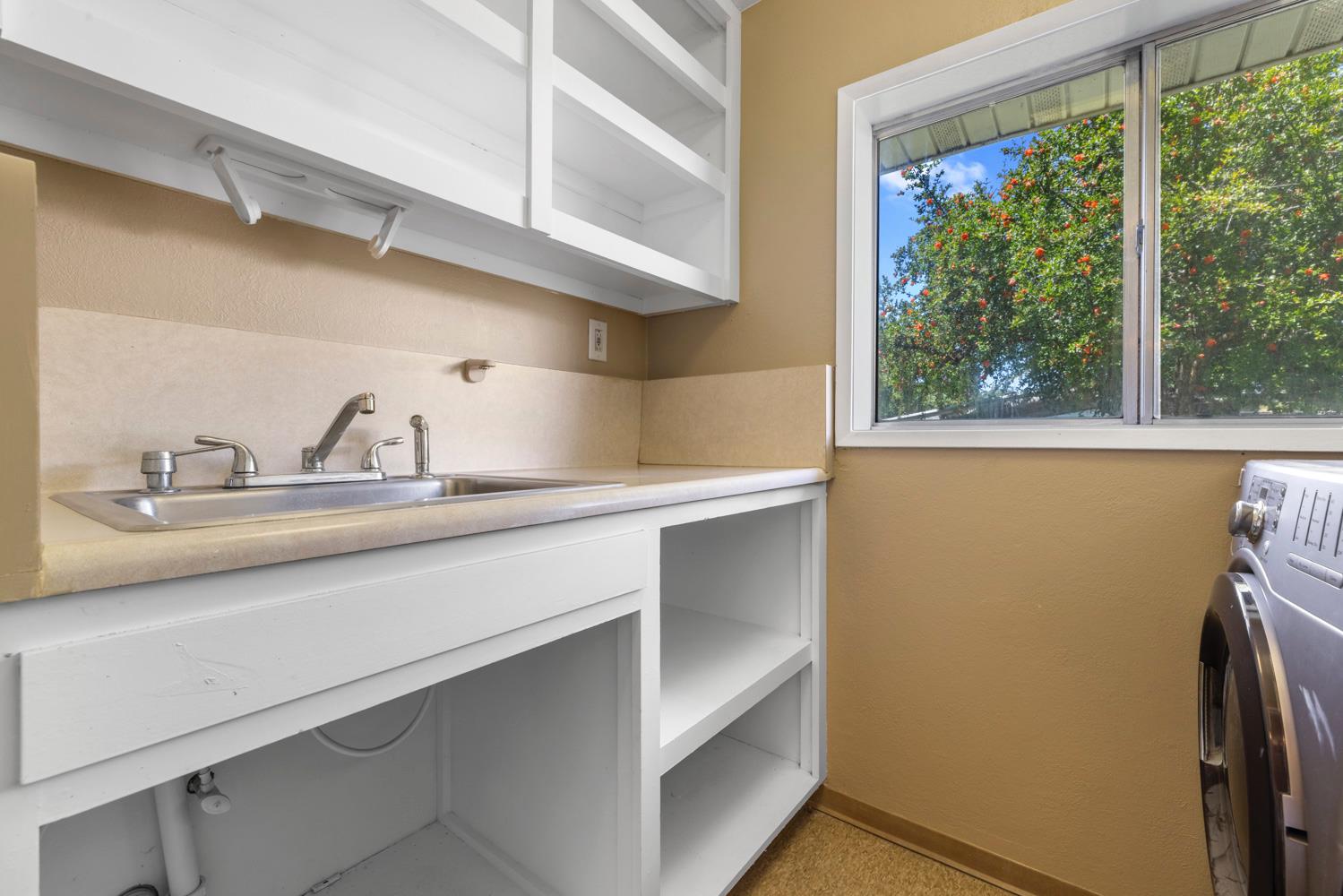 3824 Hubbard Road Stockton, CA 95215 - Photo 40 of 79 a bathroom with a sink and a window