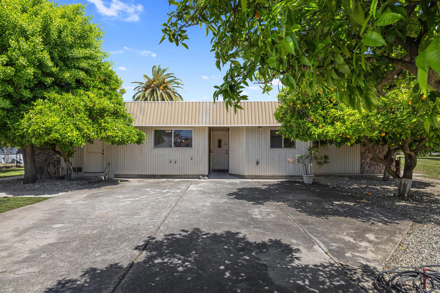 3824 Hubbard Road Stockton, CA 95215 - Photo 4 of 79 a view of a house with a tree and plants