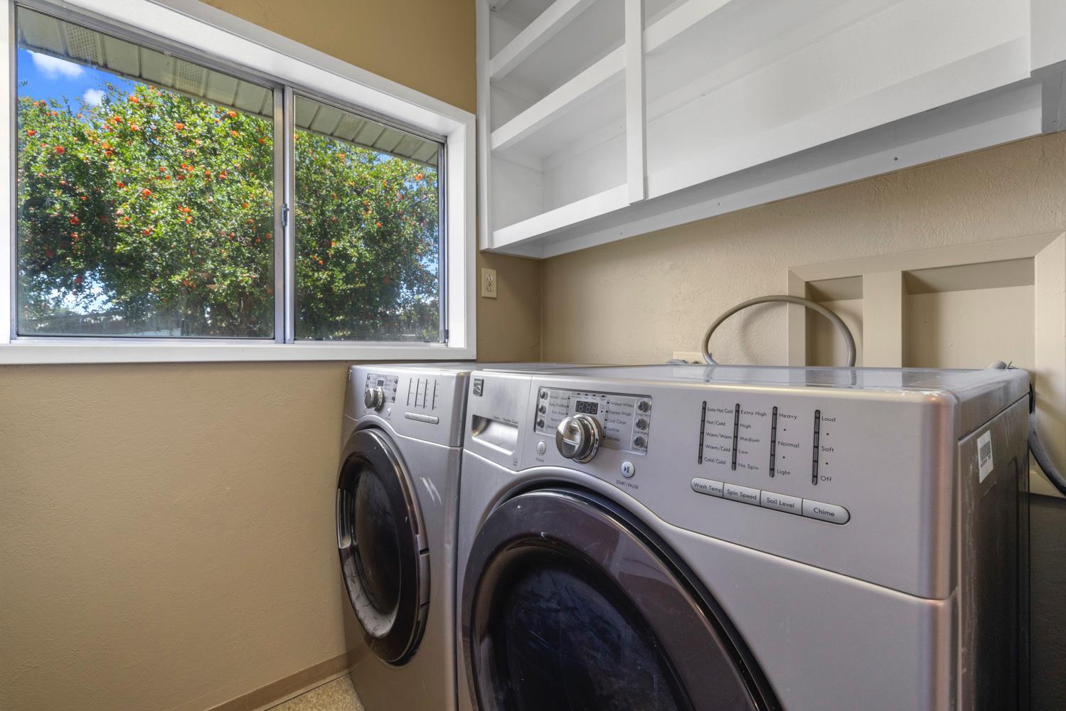 3824 Hubbard Road Stockton, CA 95215 - Photo 41 of 79 a view of washer and dryer with kitchen in the background