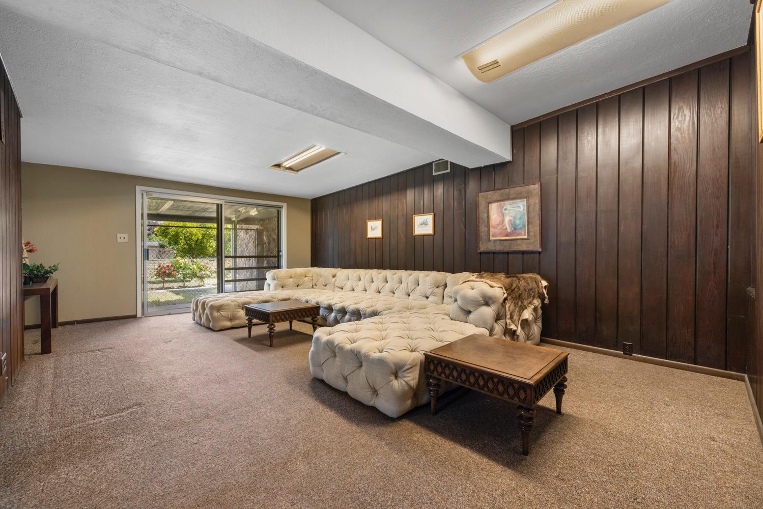 3824 Hubbard Road Stockton, CA 95215 - Photo 42 of 79 a living room with furniture and large windows