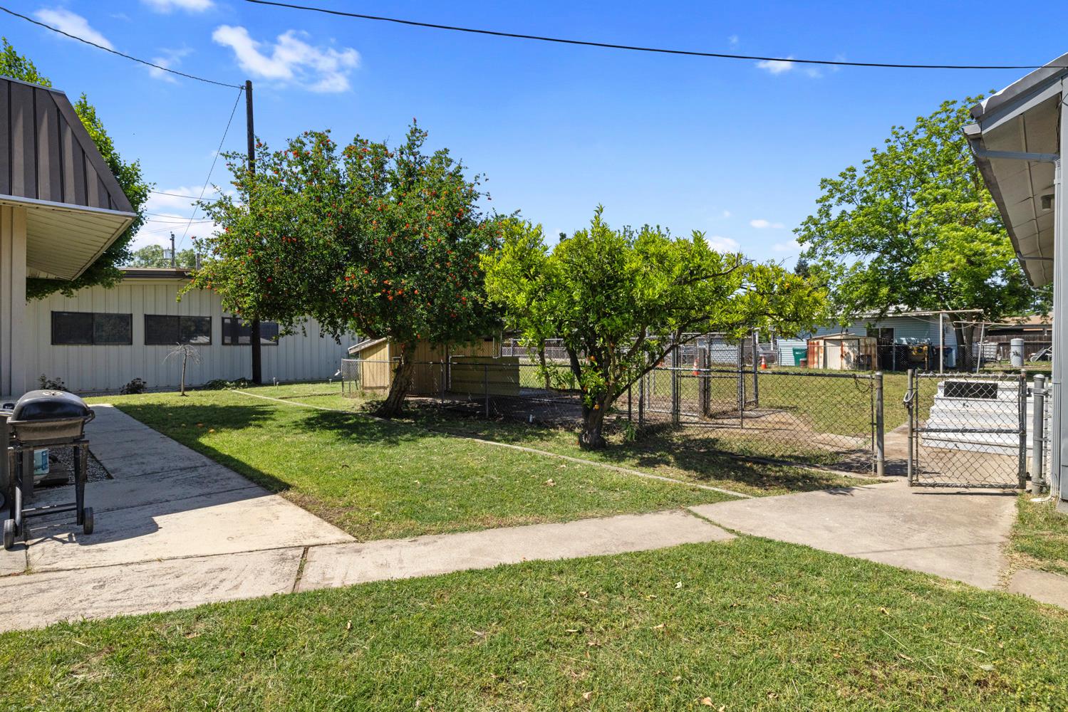3824 Hubbard Road Stockton, CA 95215 - Photo 56 of 79 a view of a house with backyard and a tree