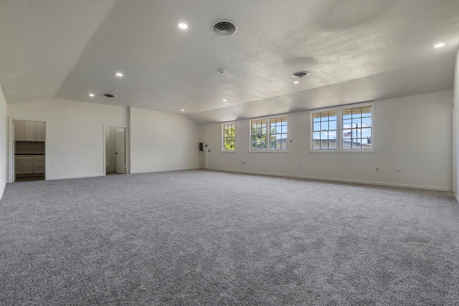 3824 Hubbard Road Stockton, CA 95215 - Photo 62 of 79 an empty room with a empty space and windows