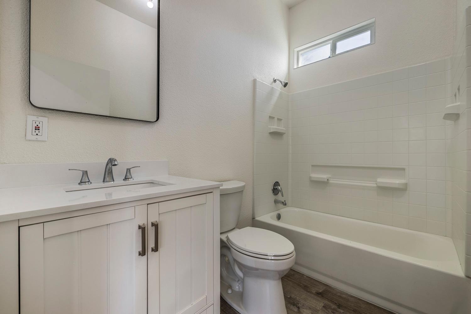 3824 Hubbard Road Stockton, CA 95215 - Photo 64 of 79 a bathroom with a sink a toilet and shower