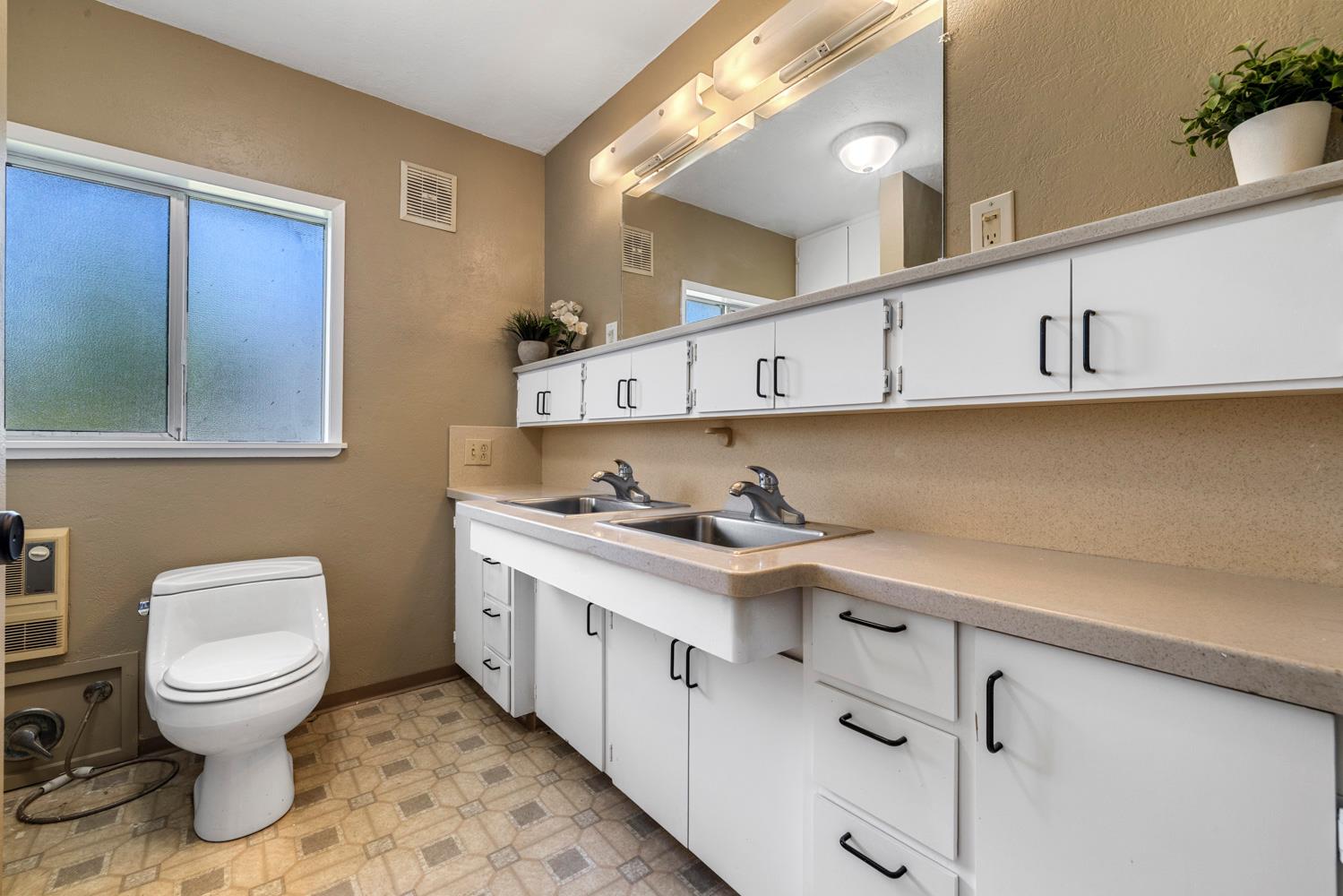 3824 Hubbard Road Stockton, CA 95215 - Photo 69 of 79 a kitchen with stainless steel appliances a sink a stove and cabinets
