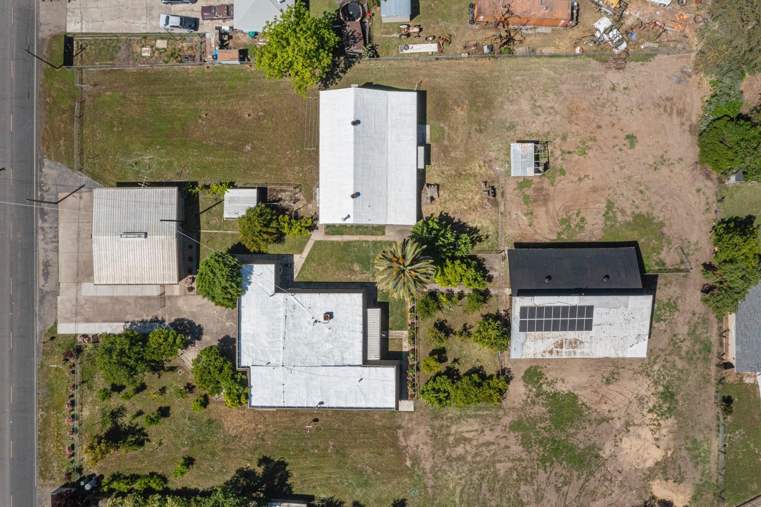 3824 Hubbard Road Stockton, CA 95215 - Photo 72 of 79 an aerial view of a house with a yard and large tree