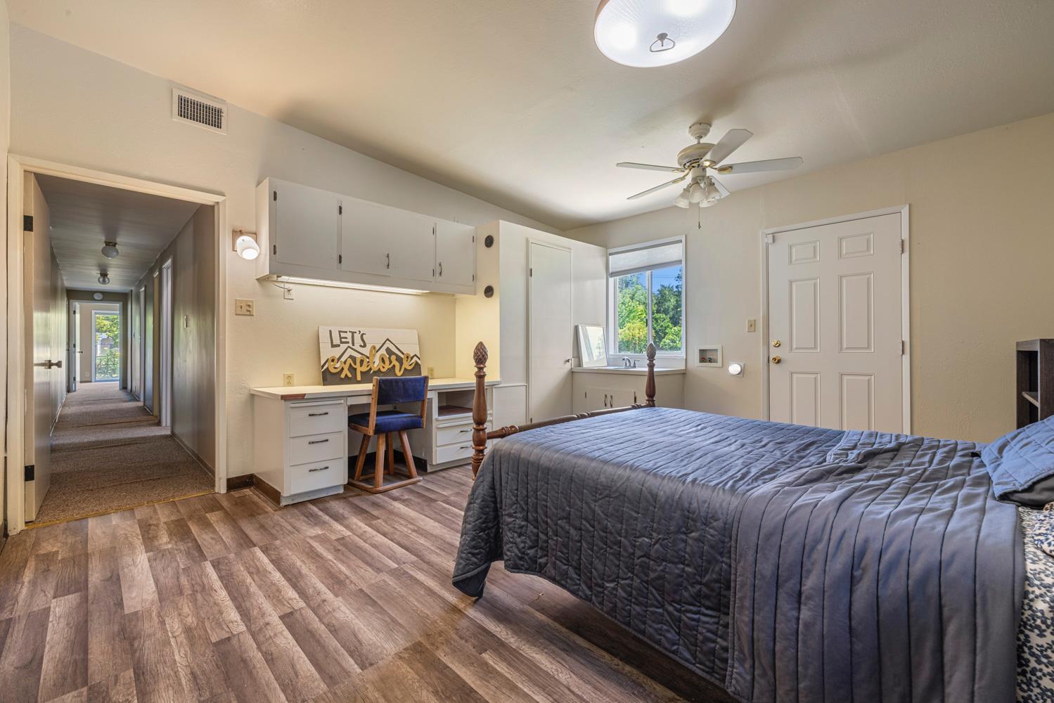 3824 Hubbard Road Stockton, CA 95215 - Photo 10 of 79 a bed room with a bed and a chandelier