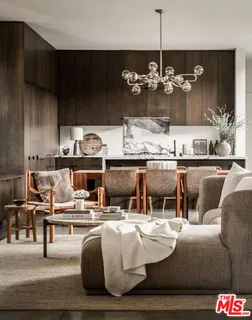 a living room with furniture and chandelier