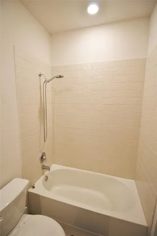 a bathroom with a bathtub and shower