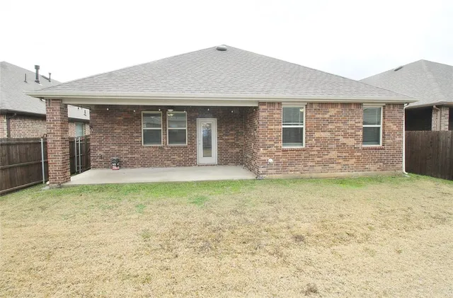 a view of a house with a garden and yard