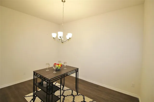 a view of a dining area with furniture and wooden floor