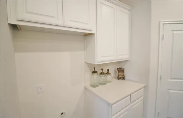 a bathroom with a sink and cabinets