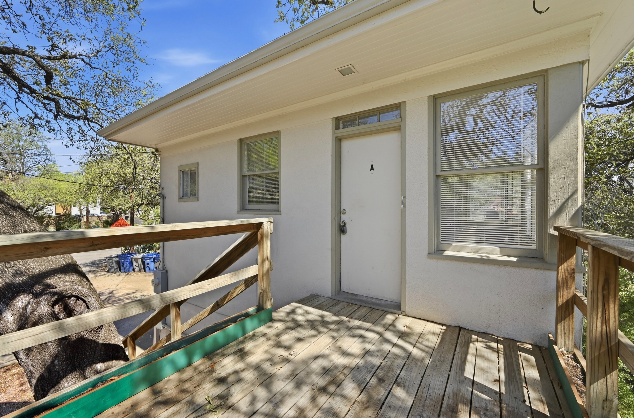 1403 Windsor Road, Unit A Austin, TX 78703 - Photo 15 of 18 a view of two chairs in the balcony