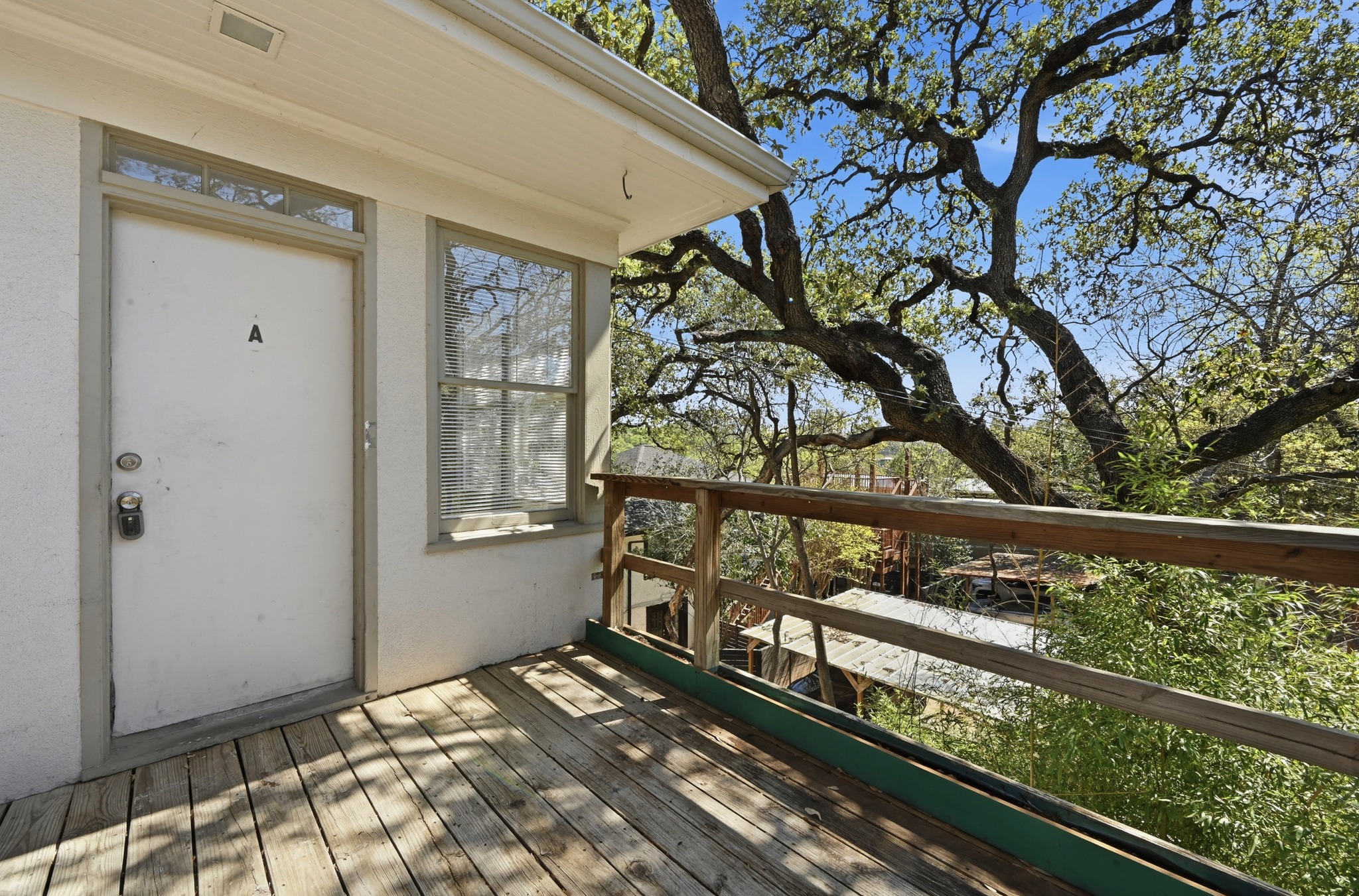 1403 Windsor Road, Unit A Austin, TX 78703 - Photo 16 of 18 a view of a street from a balcony