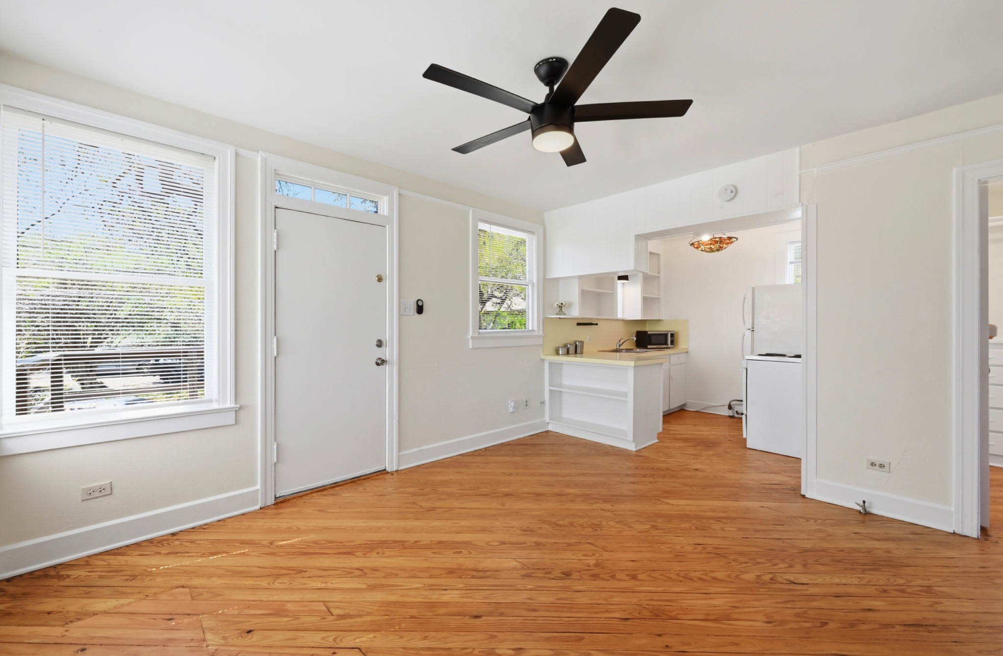 1403 Windsor Road, Unit A Austin, TX 78703 - Photo 2 of 18 a bedroom with a bed and a large window