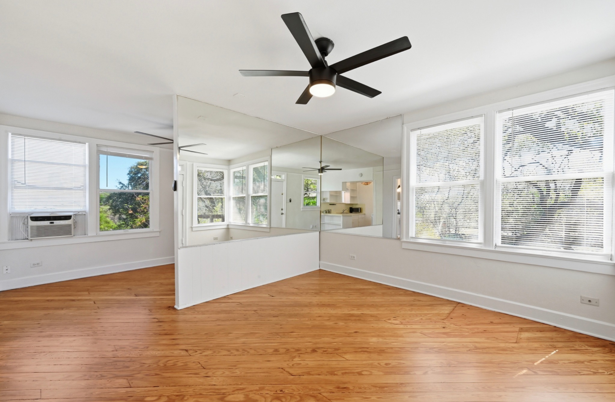 1403 Windsor Road, Unit A Austin, TX 78703 - Photo 4 of 18 a view of an empty room with a window