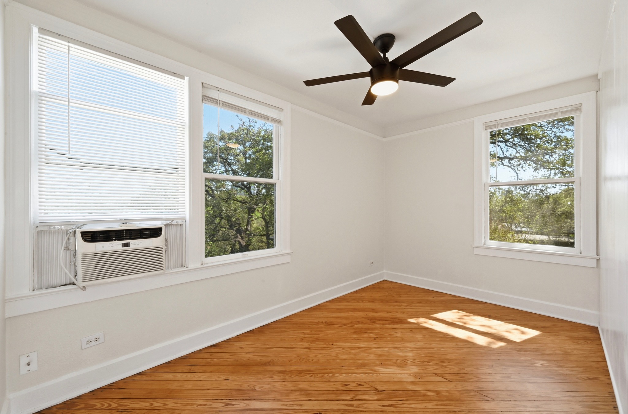 1403 Windsor Road, Unit A Austin, TX 78703 - Photo 7 of 18 a view of an empty room with a window