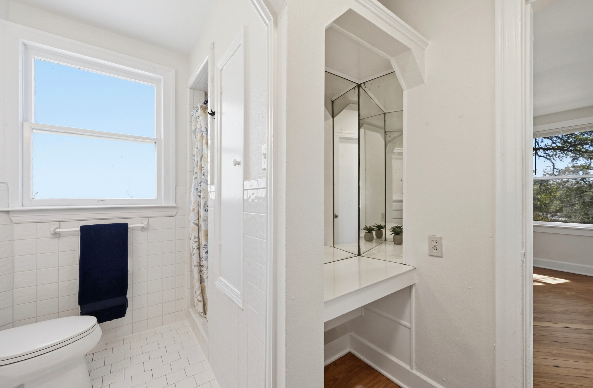 1403 Windsor Road, Unit A Austin, TX 78703 - Photo 10 of 18 a bathroom with a sink a toilet and shower