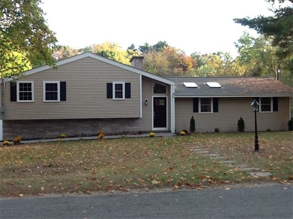 21 Meadowbrook Road Dover, MA 02030 - Photo 3 of 18 a house that has a tree in front of it