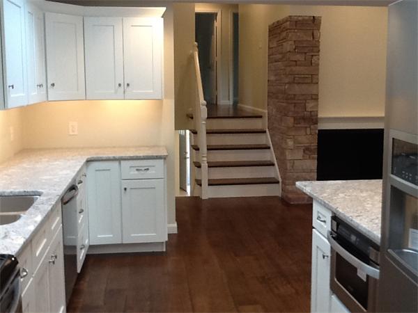 21 Meadowbrook Road Dover, MA 02030 - Photo 8 of 18 a kitchen with granite countertop a sink and a stove top oven