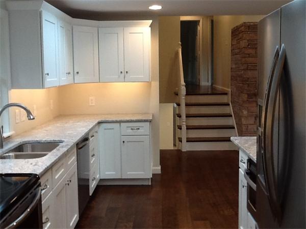 21 Meadowbrook Road Dover, MA 02030 - Photo 9 of 18 a kitchen with a sink and a refrigerator