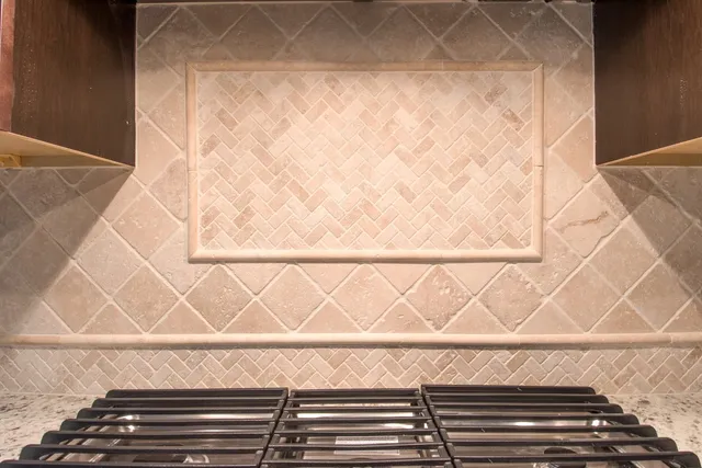 a kitchen with a sink a counter space and cabinets
