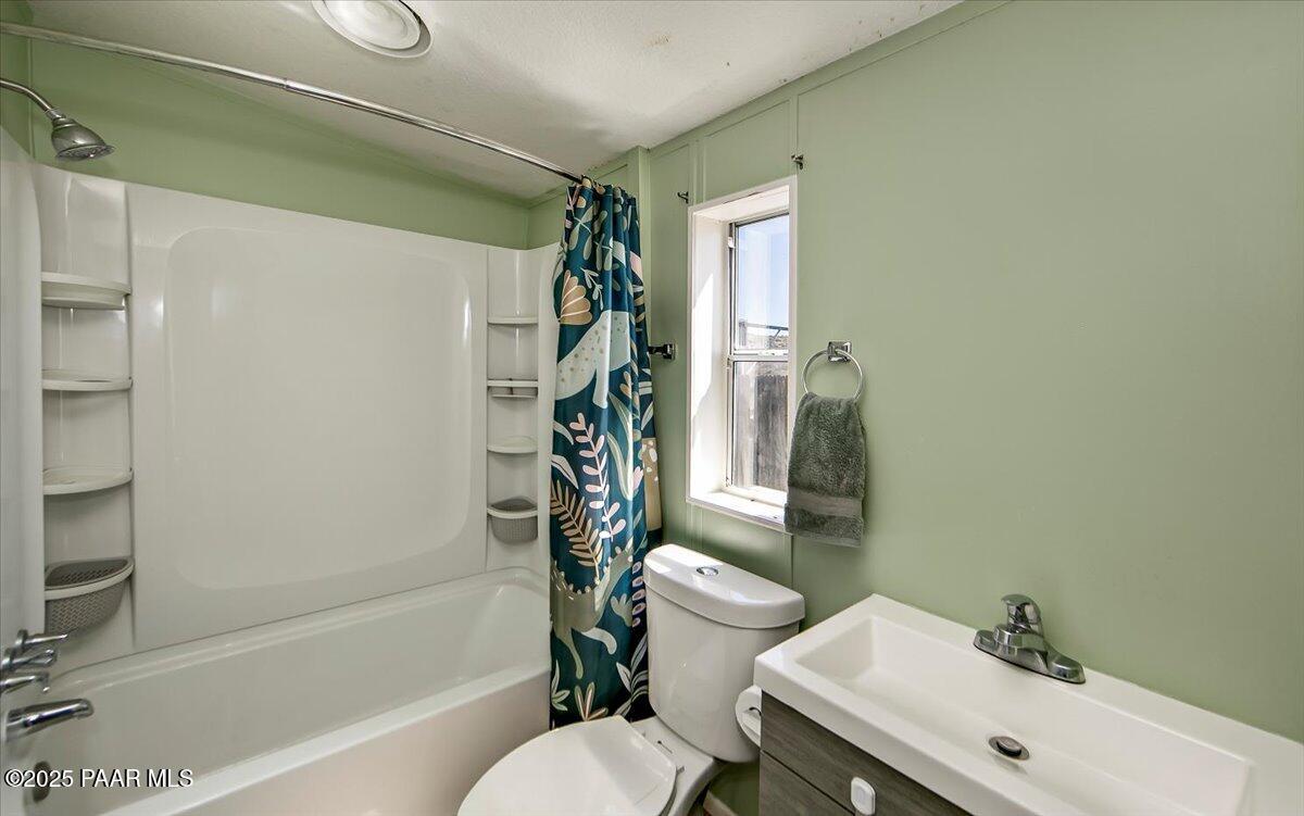 15339 South Rolling Ridge Drive Mayer, AZ 86333 - Photo 12 of 20 a bathroom with a sink toilet and shower
