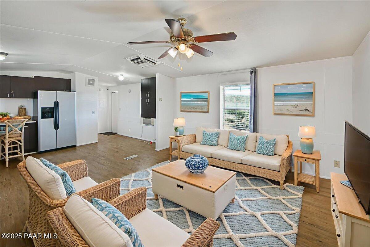 15339 South Rolling Ridge Drive Mayer, AZ 86333 - Photo 4 of 20 a living room with furniture a fireplace and a flat screen tv