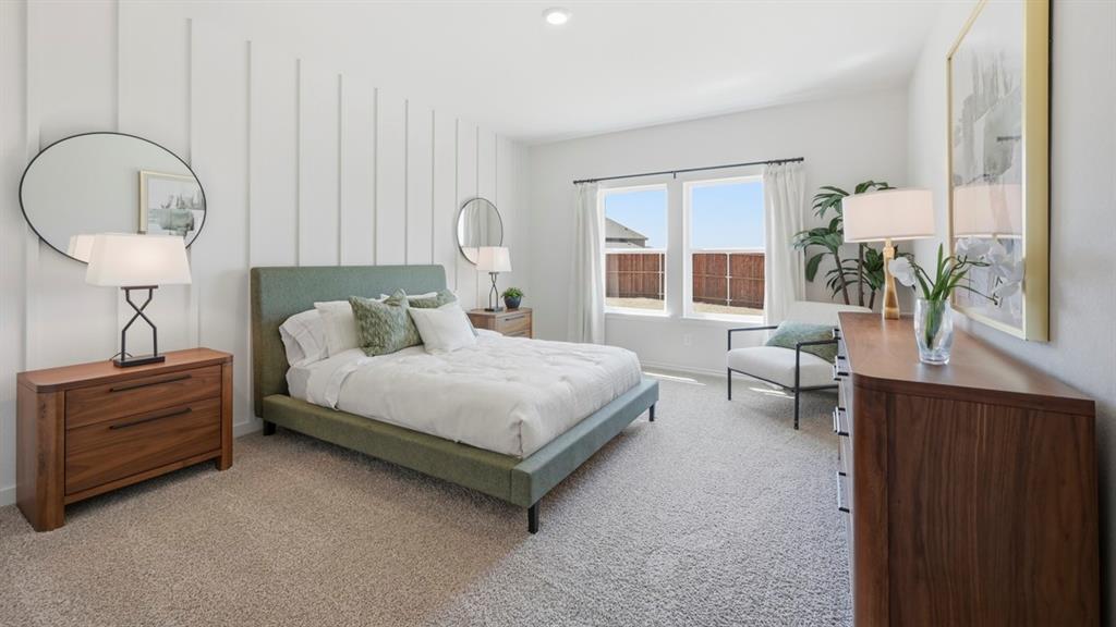 1957 Freeman Street Tyler, TX 75704 - Photo 14 of 25 Spacious interior featuring neutral carpet flooring and a prominent accent wall with vertical paneling