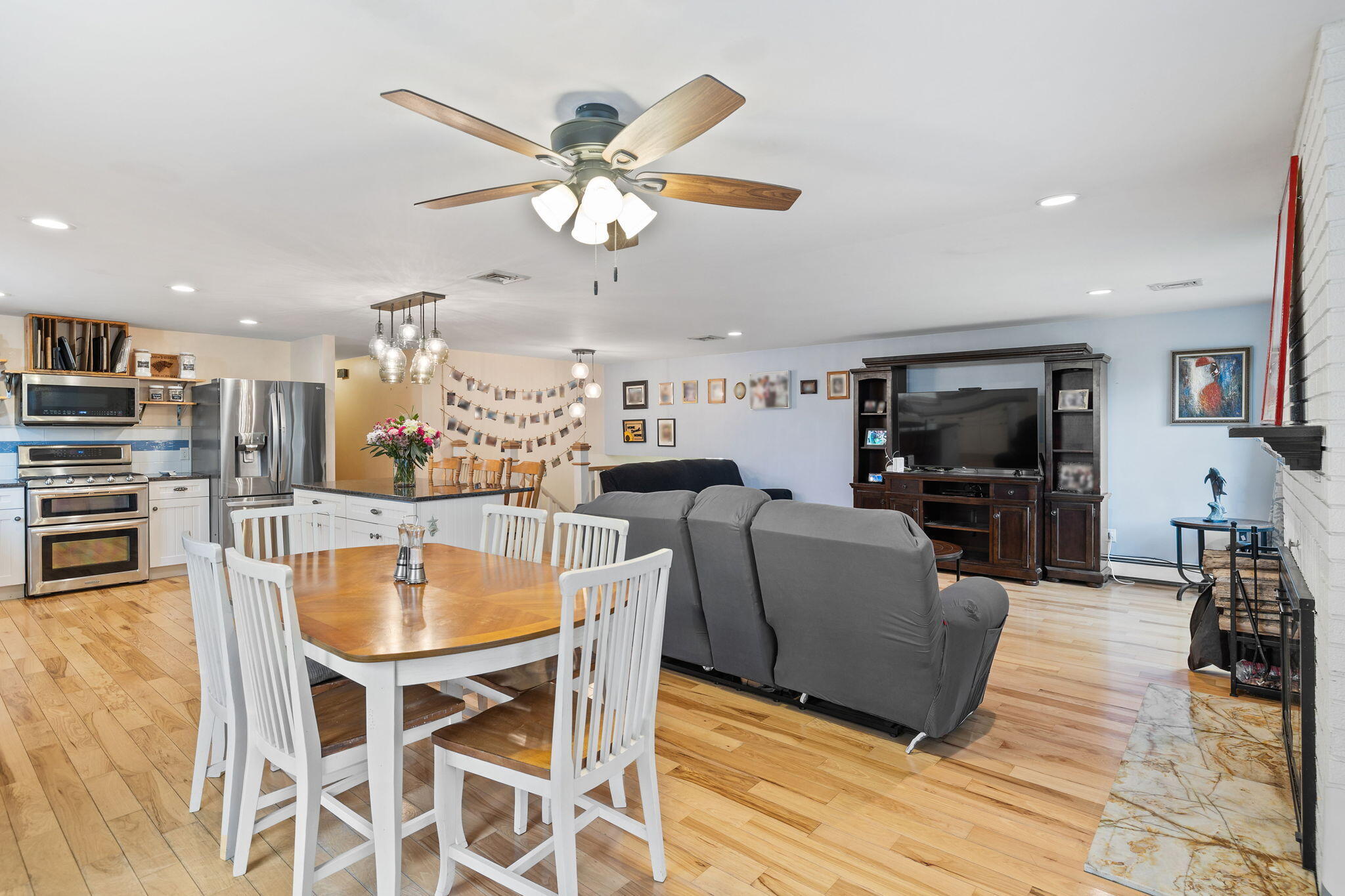 11 Michael Road Pocasset, MA 02559 - Photo 11 of 35 a kitchen with stainless steel appliances kitchen island granite countertop a table and chairs in it