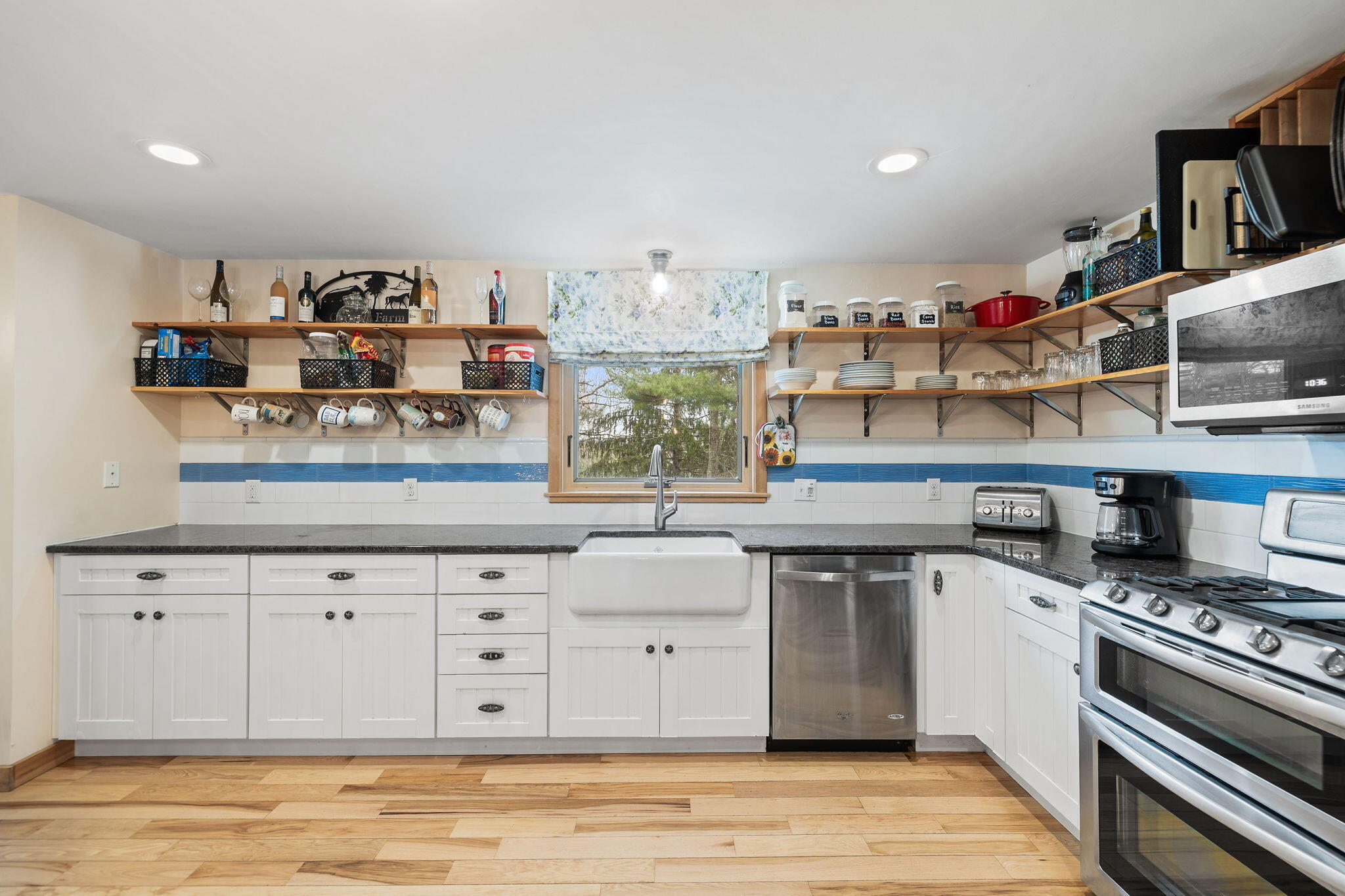 11 Michael Road Pocasset, MA 02559 - Photo 17 of 35 a kitchen with stainless steel appliances granite countertop a stove a sink and a refrigerator